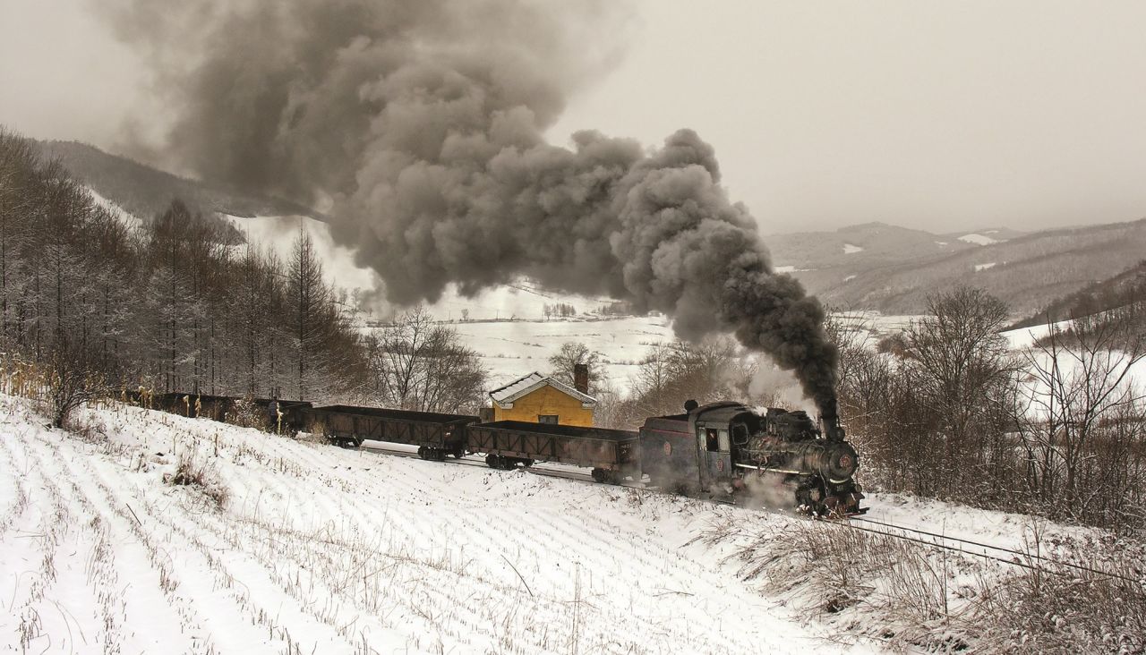 <strong>Low temperatures: </strong>Battling these extreme temperatures was part of the experience: "Once the temperature gets down around -40 C [-40 F] you have to take it very seriously or you will get frostbite," says Kitching. Pictured here: Empty coal wagons in 2005 on the Huanan Coal Railway.