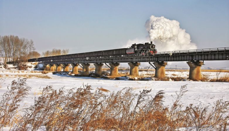 <strong>Changing face of China:</strong> "Although steam has all but finished, there are plenty of opportunities for interesting railway photographs, showing the modern scene against the magnificent Chinese scenery and the changing face of the country," says Kitching. Pictured here: A long viaduct on the Chinese National Railway line in 2009.