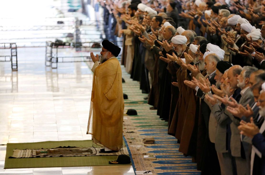 Iranian worshippers attend Friday prayers at the Imam Khomeini mosque in Tehran.