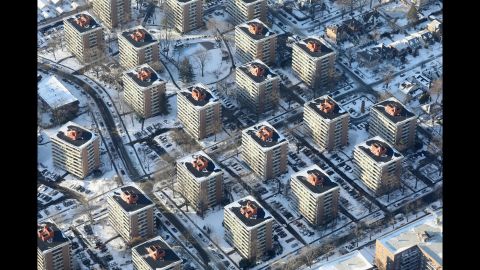Apartment buildings in New York City poke out from the snow on January 5.