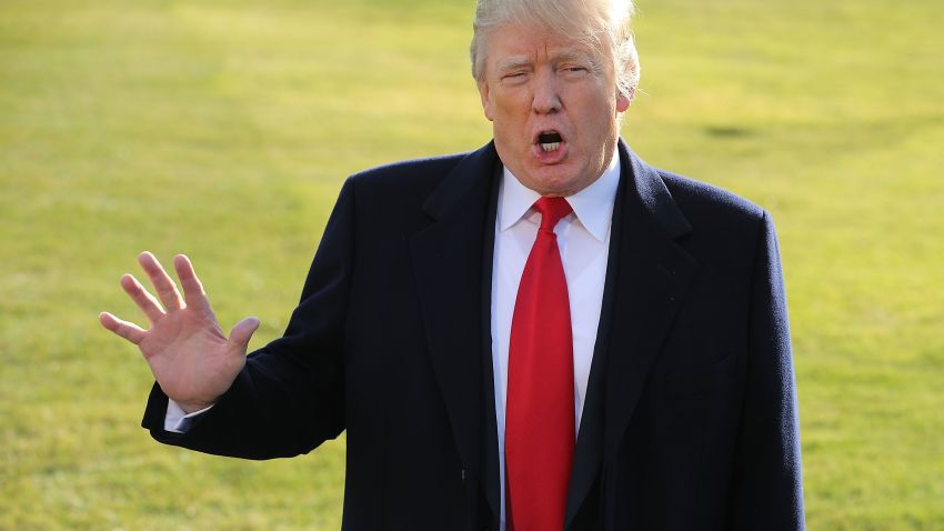 WASHINGTON, DC - DECEMBER 21:  U.S. President Donald Trump tells reporters that he is leaving the White House to visit troops at Walter Reed National Military Medical Center December 21, 2017 in Washington, DC. Trump said he was visiting the injured military service members to wish them a merry Christmas.  (Photo by Chip Somodevilla/Getty Images)