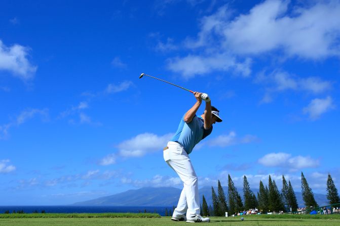 <strong>New Year's heave:</strong> Golf in 2018 teed off in Hawaii where the views are always spectacular. Jon Rahm of Spain is poised to launch one into the blue. 