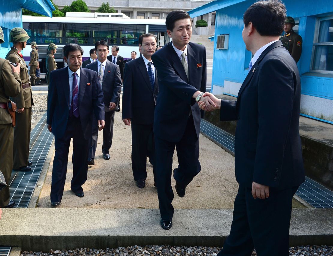 North Korean officials cross the military demarcation line (MLD) for a meeting with their South Korean counterparts on the demilitarized zone in 2013. 