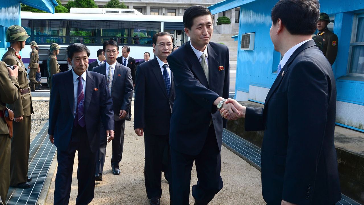 North Korean officials cross the military demarcation line (MLD) for a meeting with their South Korean counterparts on the demilitarized zone in 2013.