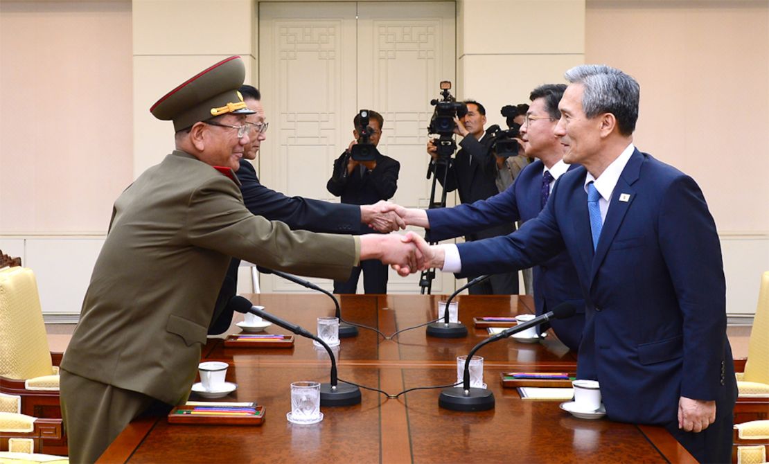 North and South Korean negotiators shake hands during high-level talks at the demilitarized zone in August 2015. 