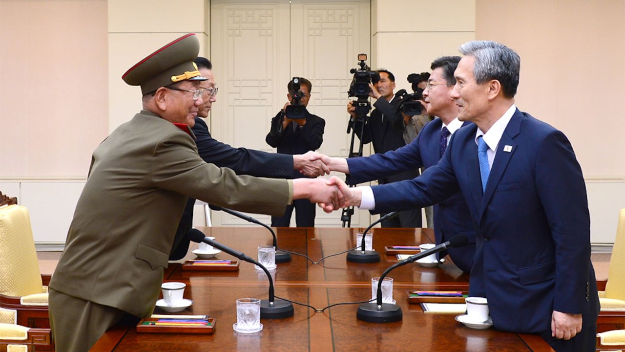 North and South Korean negotiators shake hands during high-level talks at the demilitarized zone in August 2015.