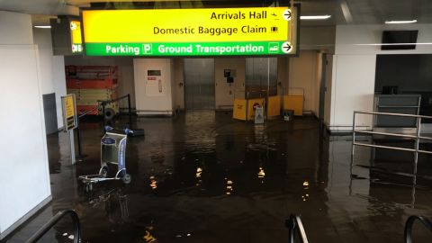 The flooding at Terminal 4 was caused by a water main break.