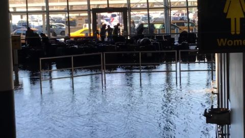 Flooding at JFK Airport in a baggage claim area. 