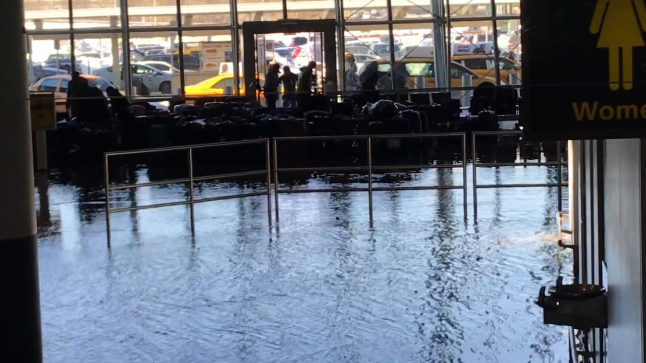 Flooding at JFK Airport in a baggage claim area.