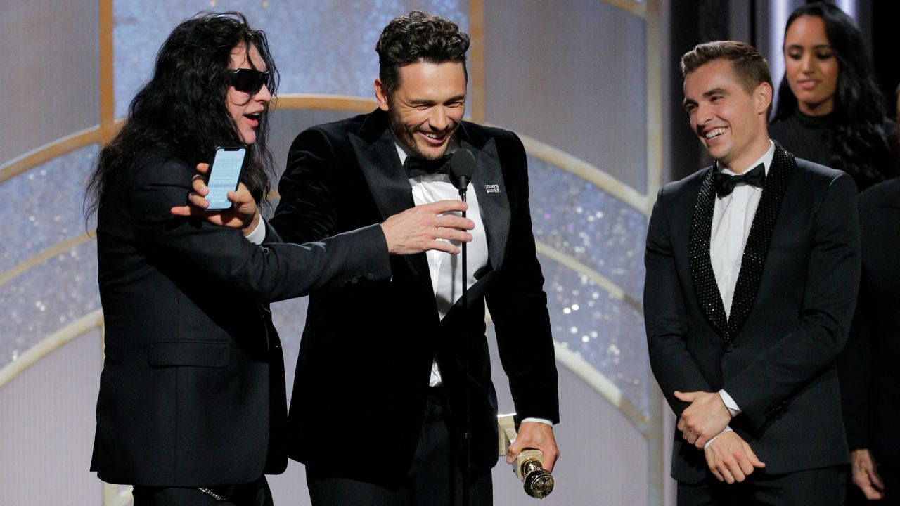 Tommy Wiseau was prevented from speaking by James Franco when the pair were onstage with Dave Franco during the Golden Globes. 