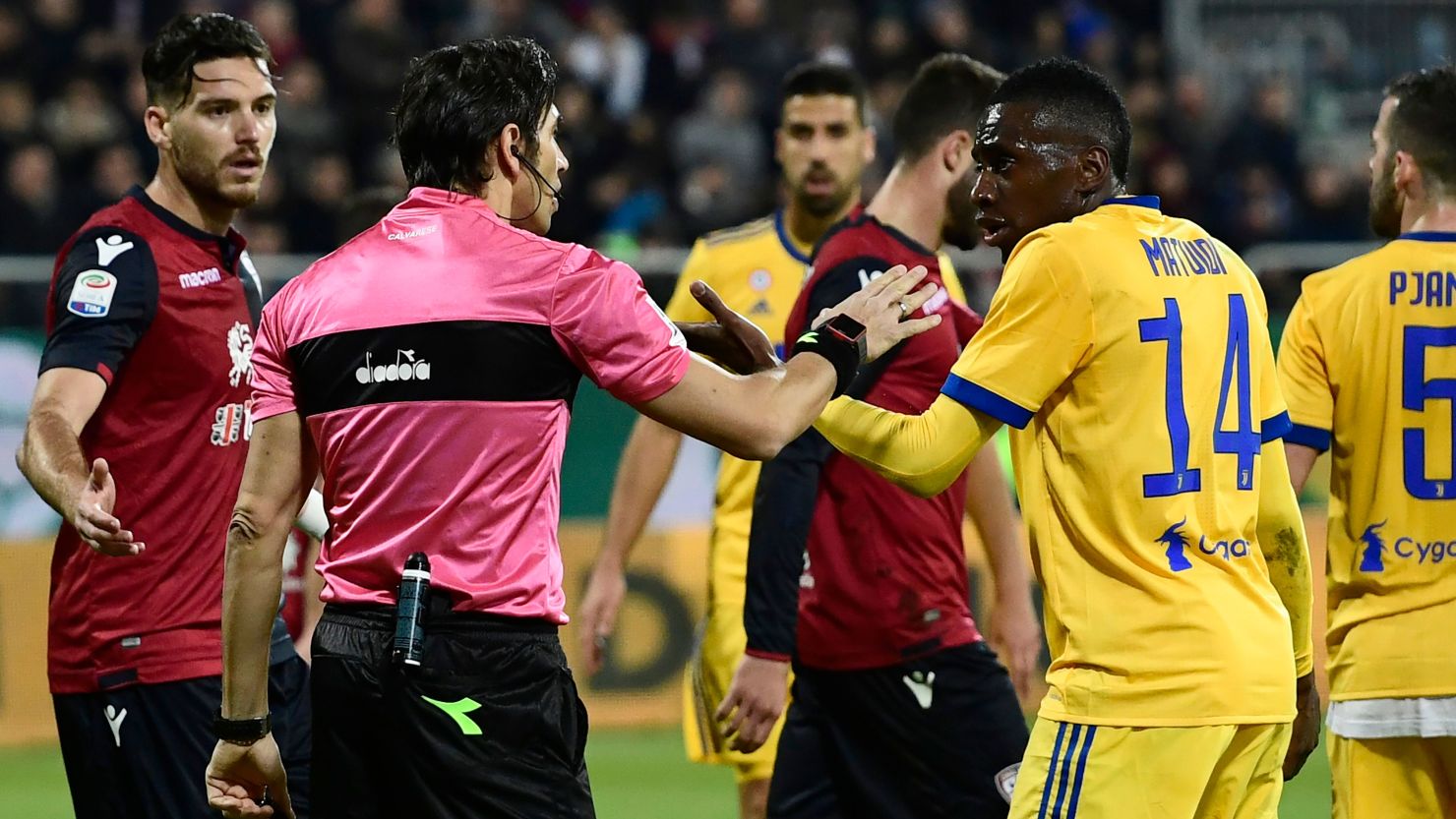 Blaise Matuidi talks with Italian referee Gianpaolo Calvarese after he suffered racist abuse during the Serie A game against Cagliari.