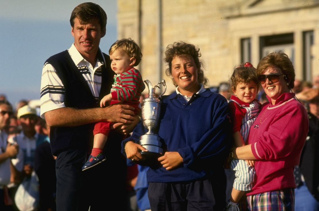 Fanny Sunesson poses with the Claret Jug alongside Nick Faldo and his two children at the 1990 British Open.