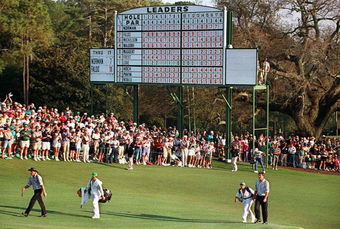 Faldo and Sunesson follow Greg Norman past the leaderboard to the eighteenth green during the final round action at the 1996 Masters.