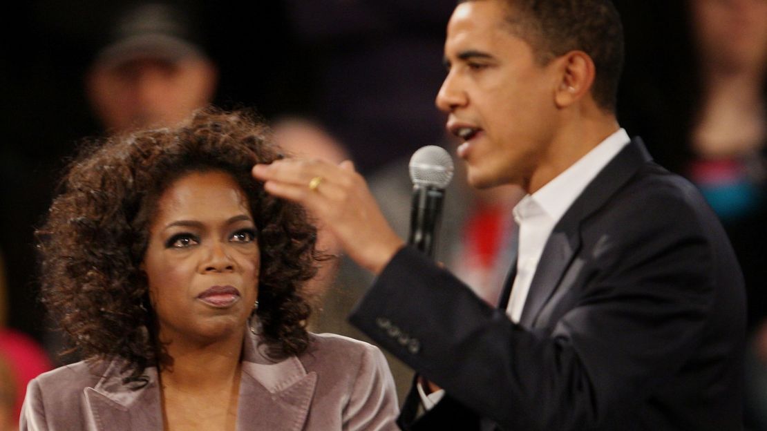 Oprah Winfrey with then-presidential candidate Barak Obama at a campaign rally in 2007 in Des Moines, Iowa. 