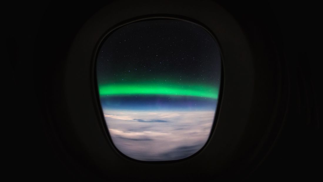 <strong>Pilot privileges: </strong>While the view from the cabin can be impressive -- it has nothing on the cockpit panoramas. As van Heijst says, "the whole experience is much more interesting if you have these big windows around you and you're physically controlling the airplane." <em>Pictured here: the Aurora Borealis pictured through the airplane window.</em>