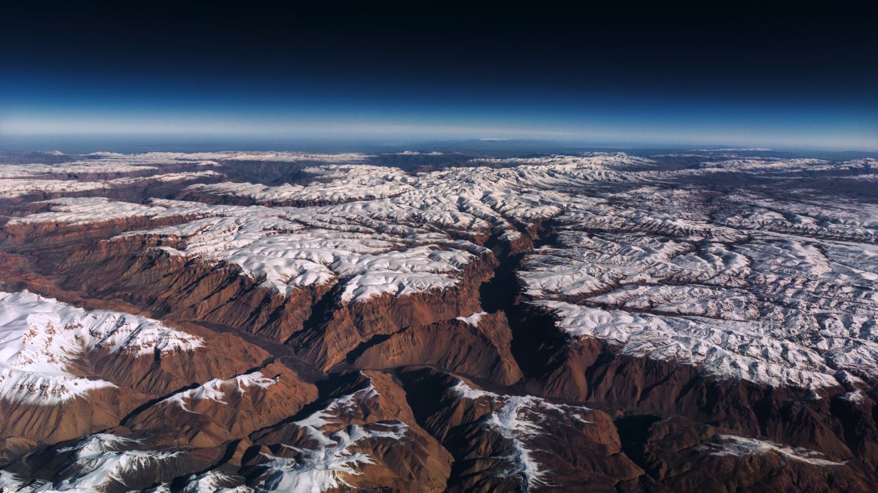van Heijst takes photographs from the cockpit window, including this shot of Afghanistan.