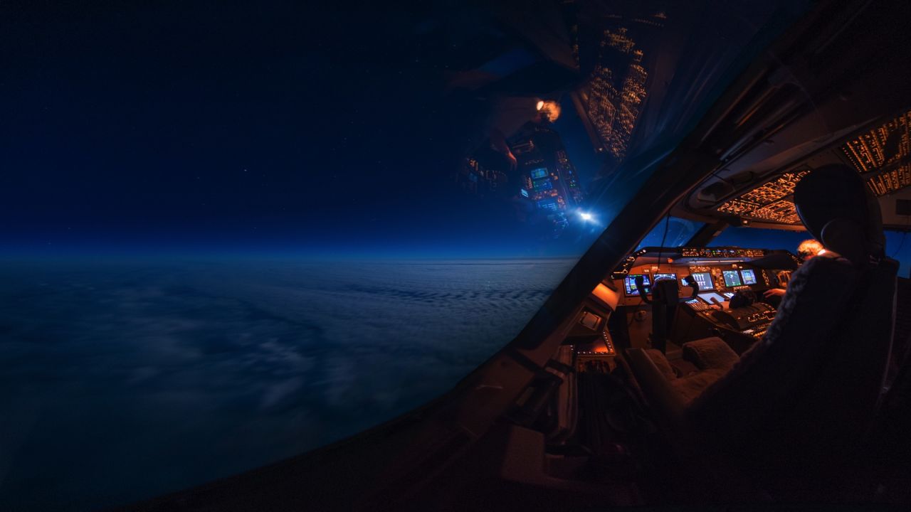 <strong>Expressions of solitude</strong>: Van Heijst has started experimenting with different angles for different effects. "These pictures where you see partially the cockpit and partially the outside world, I think this is one of the few ways I can express in a photograph the feeling of solitude," he says.<em> Pictured here: Moonlight in the cockpit.</em>