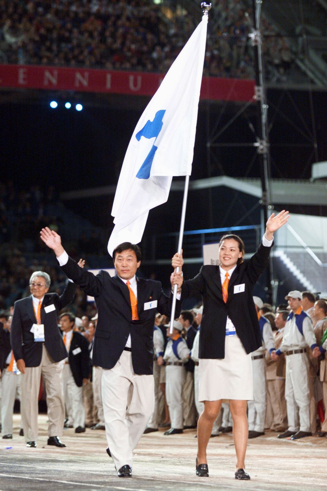 North Korea's Pak Jang Choo, left, and South Korea's Chung Eun-Soon carry a special flag showing the Korean peninsula as their teams march together at the 2000 Summer Olympics. 