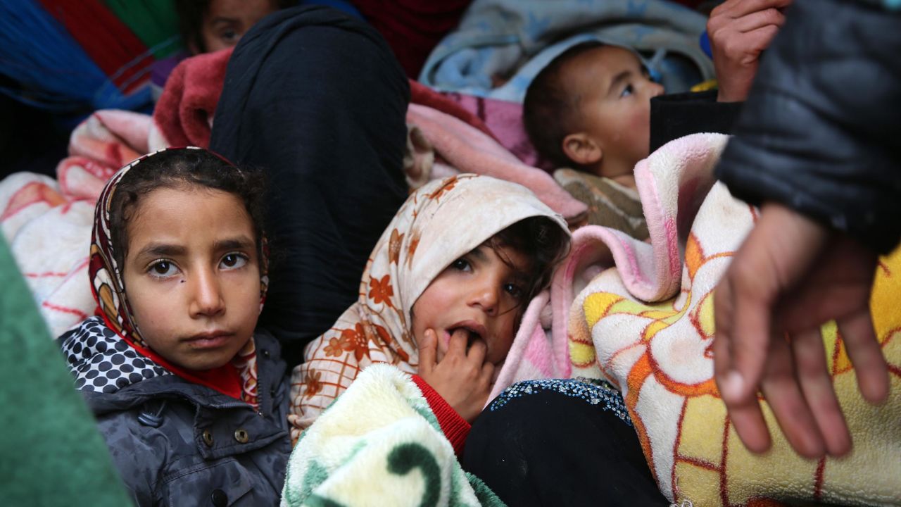 Syrians who fled Idlib province take shelter at a camp near the Turkish border on Thursday. 