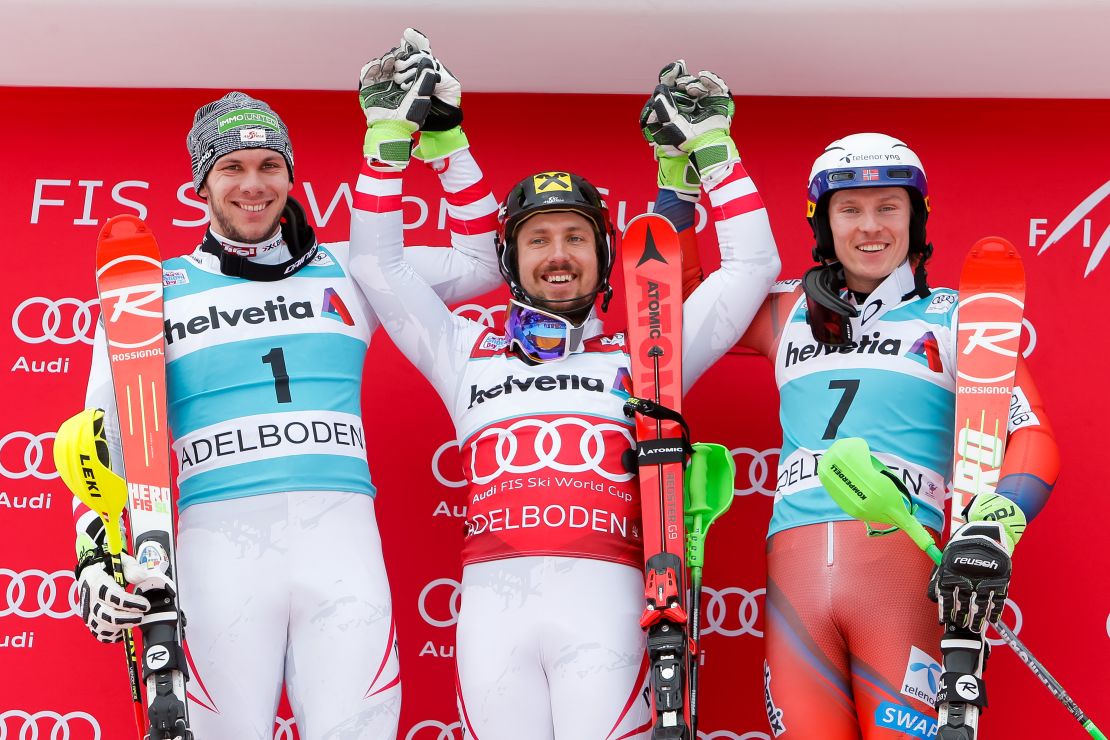 Marcel Hirscher (C) celebrates after Sunday's slalom event in Adelboden, Switzerland.