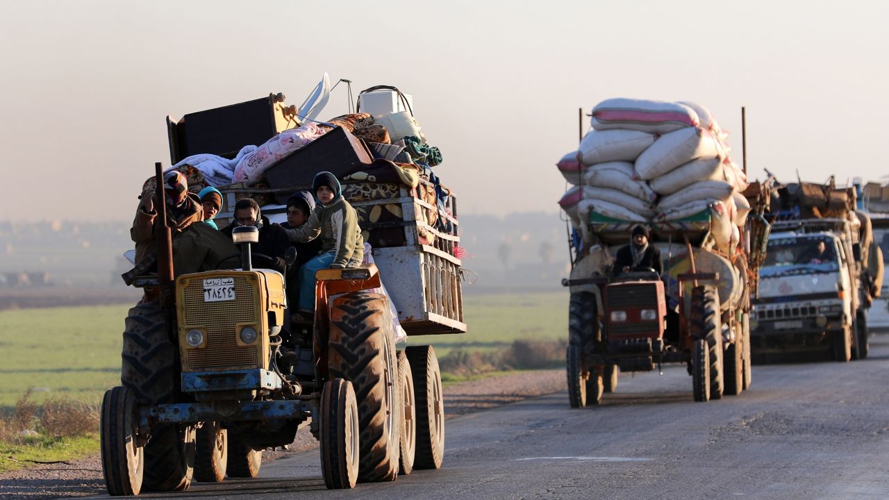 Syrians who fled Idlib province travel along a road in a rebel-held area near Saraqib on Sunday. 
