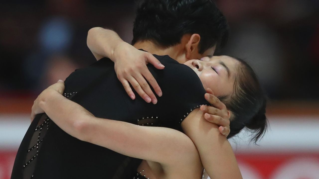 The two North Korean skaters embrace after performing at the pairs free skating during the Nebelhorn Trophy.