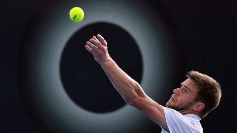 Ryan Harrison serves in front of an advertisement during a second-round match at the Brisbane International on Thursday, January 4. Harrison eventually advanced to the final of the tournament, which was played in Brisbane, Australia.