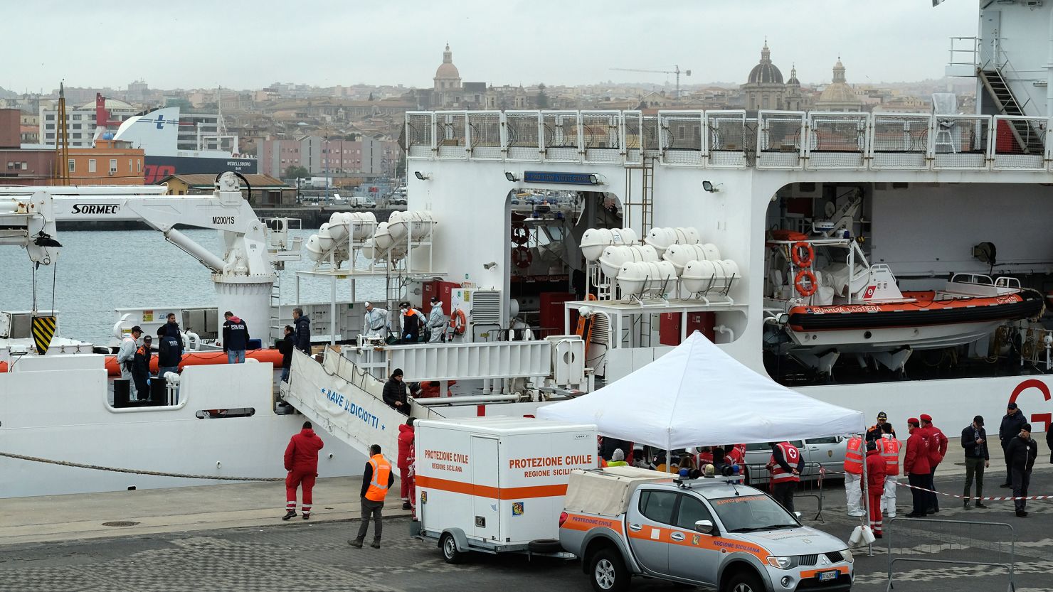 Bodies recovered from a wreck off the coast of Libya are taken ashore in Italy on Monday. 