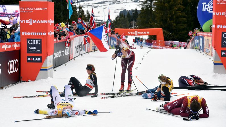 Cross-country skiers collapse in exhaustion after a World Cup race in Cavalese, Italy, on Sunday, January 7.