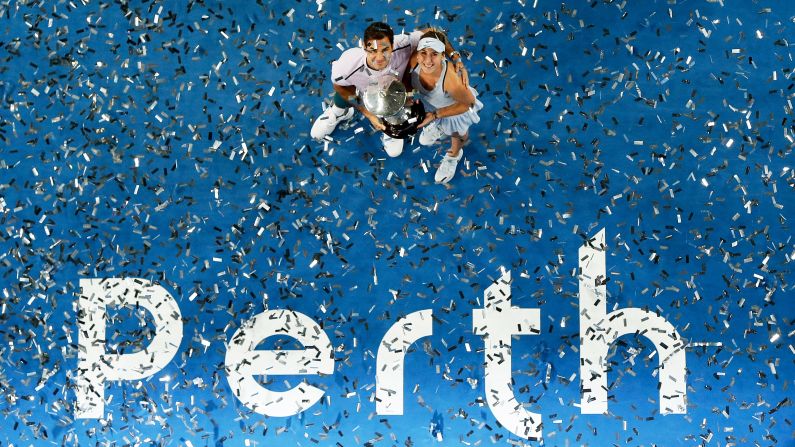 Roger Federer and Belinda Bencic hold the winners trophy after their mixed-doubles victory won the Hopman Cup for Switzerland on Saturday, January 6. The team competition took place in Perth, Australia.