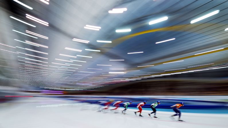 In this photo, taken with a slow shutter speed, athletes compete in the European Speed Skating Championships on Sunday, January 7.