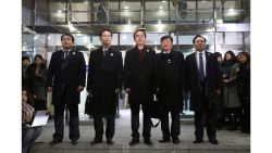 South Korean Unification Minister Cho Myoung-gyon, center, poses with other delegates before leaving for the border village of Panmunjom to attend South and North Korea meeting, at the Office of the South Korea-North Korea Dialogue in Seoul, South Korea, Tuesday, Jan. 9, 2018. (AP Photo/Ahn Young-joon)