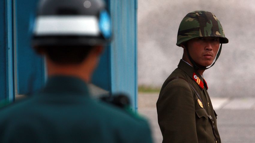 PANMUNJOM, SOUTH KOREA - SEPTEMBER 29: (SOUTH KOREA OUT) In this handout photo from Chosun Daily News, a North Korean Soldier (R) looks at South Korean soldier at the border village of Panmunjom between North and South Korea on September 29, 2010 in Panmunjom, South Korea. The two Koreas plan to hold military talks in Panmunjom in an attempt to ease tensions between the countries. The mooted talks come in the wake of speculation over the succession of leader Kim Jong-il by his son Kim Jongun. (Photo by Lee Tae-Kyung/Getty Images)