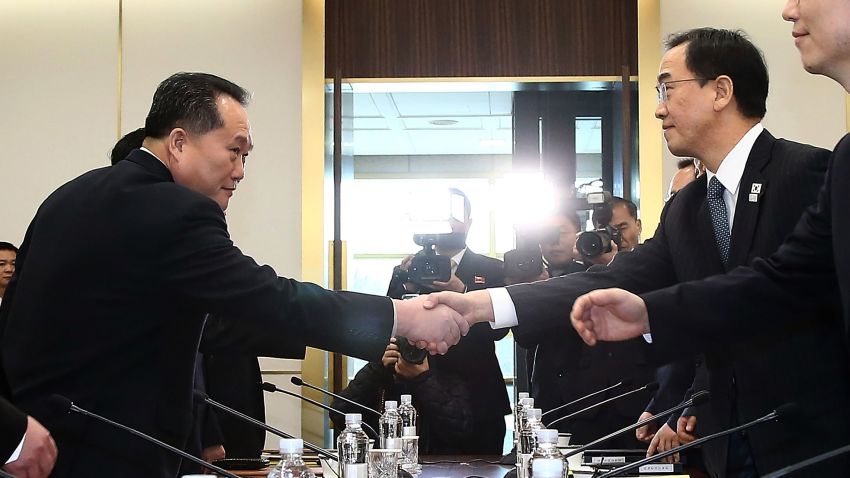 PANMUNJOM, SOUTH KOREA - JANUARY 09:  South Korean Unification Minister Cho Myoung-gyon (R) shakes hands with the head of North Korean delegation Ri Son-Gwon (L) before their meeting at the Panmunjom in the Demilitarized Zone on January 9, 2018 in Panmunjom, South Korea. South and North Korea are scheduled to begin their first official face-to-face talks in two years on Tuesday, January 9, 2017.  (Photo by Korea Pool/Getty Images)