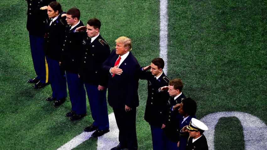 U.S. President Donald Trump on field during the national anthem prior to the CFP National Championship presented by AT&T between the Georgia Bulldogs and the Alabama Crimson Tide at Mercedes-Benz Stadium on January 8, 2018 in Atlanta, Georgia.  (Photo by Scott Cunningham/Getty Images)