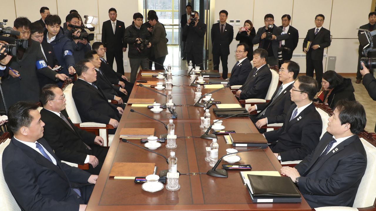 South Korean Unification Minister Cho Myoung-gyon, third from right, and the head of North Korean delegation Ri Son Gwon, third from left, with their delegation meet at the Panmunjom in the Demilitarized Zone in Paju, South Korea, Tuesday, Jan. 9, 2018. South Korean media said North and South Korea have begun talks at their border about how to cooperate in next month's Winter Olympics and how to improve their long-strained ties. (Korea Pool/Yonhap via AP)