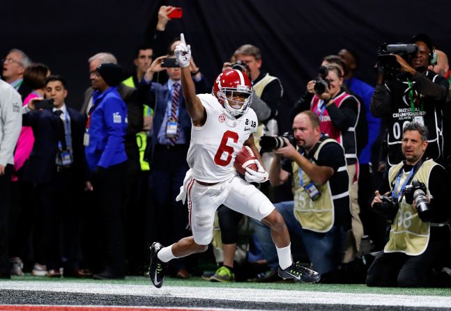 Alabama wide receiver DeVonta Smith celebrates after catching a 41-yard touchdown pass in overtime to beat Georgia 26-23 and win the national title on Monday, January 8. It is Alabama's fifth championship in the last nine years. <a href="index.php?page=&url=http%3A%2F%2Fwww.cnn.com%2F2018%2F01%2F08%2Fsport%2Fgallery%2Fcollege-football-national-championship-2018-alabama-georgia%2Findex.html" target="_blank">See more photos from the game</a>