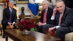 US President Donald Trump, meets with Congressional leadership including Senate Majority Leader Mitch McConnell (C), Republican of Kentucky, and Senate Minority Leader Chuck Schumer (R),  in the Oval Office at the White House in Washington, DC, December 7, 2017. / AFP PHOTO / SAUL LOEB        (Photo credit should read SAUL LOEB/AFP/Getty Images)