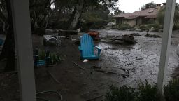 A river up mud collects against the home of Ben Hyatt in Montecito, California, on the morning of Tuesday, January 9, 2018.