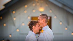 Australian Commonwealth Games sprinter Craig Burns (R) and fiance Luke Sullivan (L) prepare ahead of their marriage ceremony at Summergrove Estate, New South Wales on January 8, 2018. 
Australia officially become the 26th country to legalise same-sex marriage after the law was passed on December 9, 2017, with the overwhelming backing of the Federal Parliament. / AFP PHOTO / Patrick HAMILTON        (Photo credit should read PATRICK HAMILTON/AFP/Getty Images)