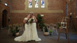 epaselect epa06425868 Rebecca Hickson (L) and Sarah Turnbull pose for photographs after being married in a ceremony in Newcastle, New South Wales, Australia, 09 January 2018. The day marks the first official day same-sex marriage ceremonies can take place in Australia after legislation was passed in parliament in December 2017.  EPA-EFE/DAN HIMBRECHTS  AUSTRALIA AND NEW ZEALAND OUT