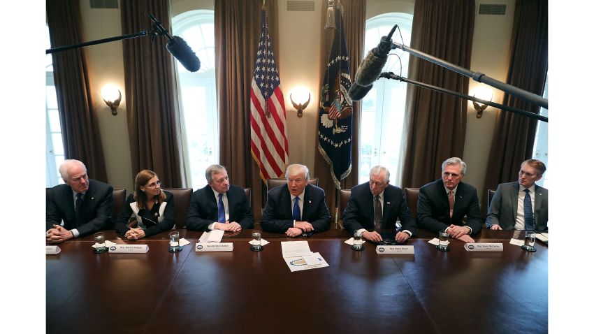 WASHINGTON, DC - JANUARY 09:  U.S. President Donald Trump (C) presides over a meeting about immigration with Republican and Democrat members of Congress, including (L-R) Senate Majority Whip John Cornyn (R-TX), Rep. Martha McSally (R-AZ), Senate Minority Whip Richard Durbin (D-IL), House Minority Whip Steny Hoyer (D-MD), House Majority Leader Kevin McCarthy (R-CA) and Sen. James Lankford (R-OK) in the Cabinet Room at the White House January 9, 2018 in Washington, DC. In addition to seeking bipartisan solutions to immigration reform, Trump advocated for the reintroduction of earmarks as a way to break the legislative stalemate in Congress.  (Photo by Chip Somodevilla/Getty Images)