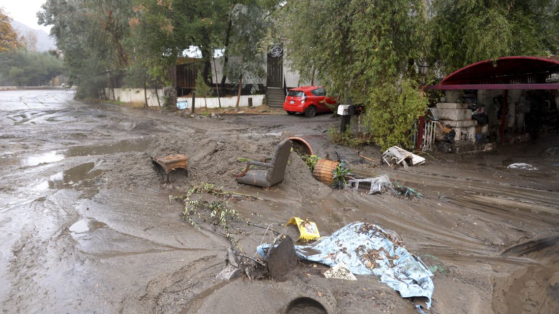 Mud washes away personal belongings in the Sun Valley neighborhood of Los Angeles on January 9, 2018.
