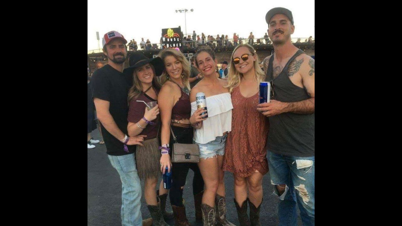 Just hours before the shooting, Rachel Sheppard, third from left, and Alaina Kelly, center in white, enjoyed the festival with thousands of other country music fans.