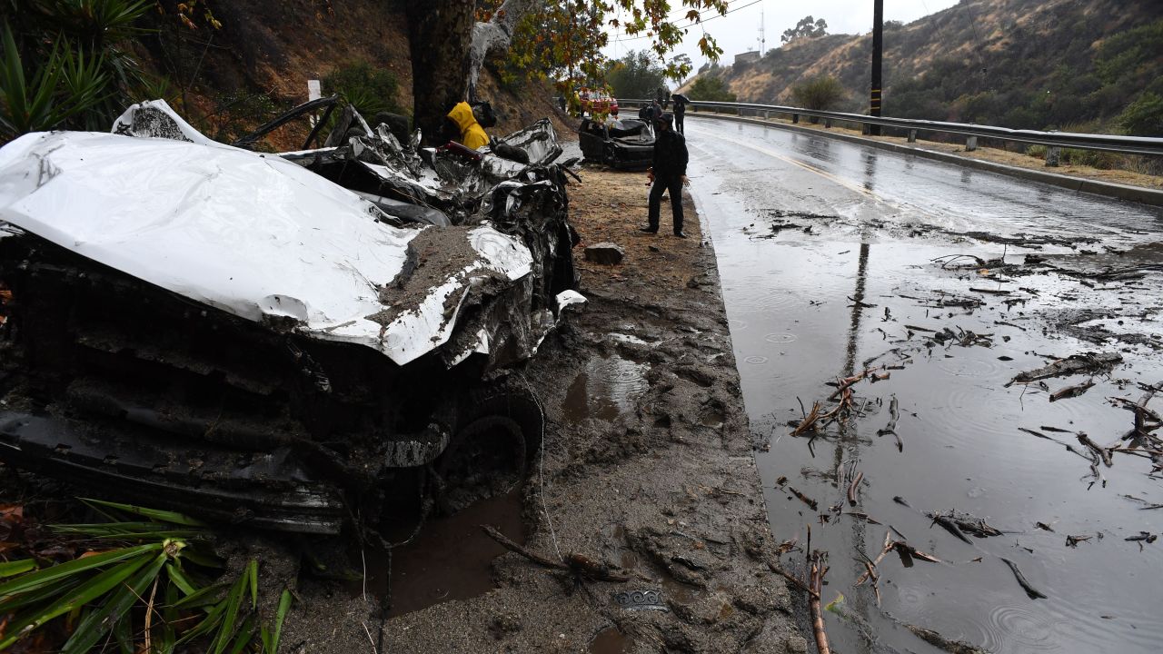 Mud fillled a Burbank street, destroyed two cars and damaged property.