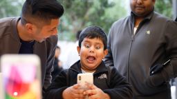 A boy makes faces while testing out the Animoji feature on an iPhone X at the Apple Store Union Square on November 3, 2017, in San Francisco, California.
Apple's flagship iPhone X hits stores around the world as the company predicts bumper sales despite the handset's eye-watering price tag, and celebrates a surge in profits. / AFP PHOTO / Elijah Nouvelage        (Photo credit should read ELIJAH NOUVELAGE/AFP/Getty Images)