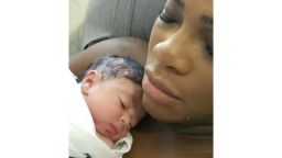 Serena Williams posted a photo of herself cradling her newborn daughter on her official Instagram account.