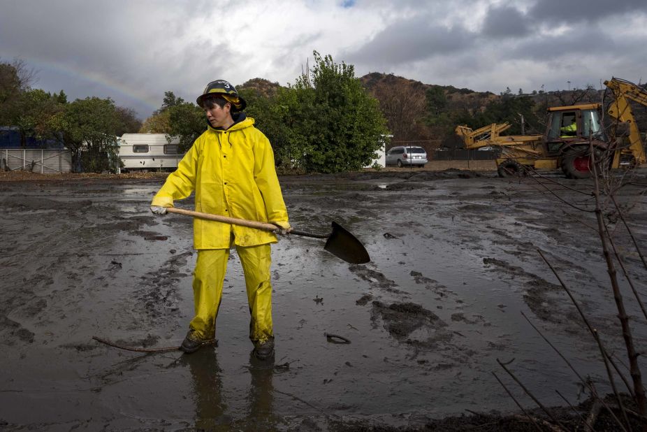 A firefighter clears debris in Los Angeles on January 9, 2018.