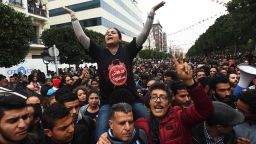 TOPSHOT - Tunisians shout slogans during a demonstration against the government and price hikes on January 9, 2018 in Tunis.Protests hit several parts of Tunisia where dozens of people were arrested and one man died in unclear circumstances amid anger over rising prices, authorities said. / AFP PHOTO / FETHI BELAID        (Photo credit should read FETHI BELAID/AFP/Getty Images)