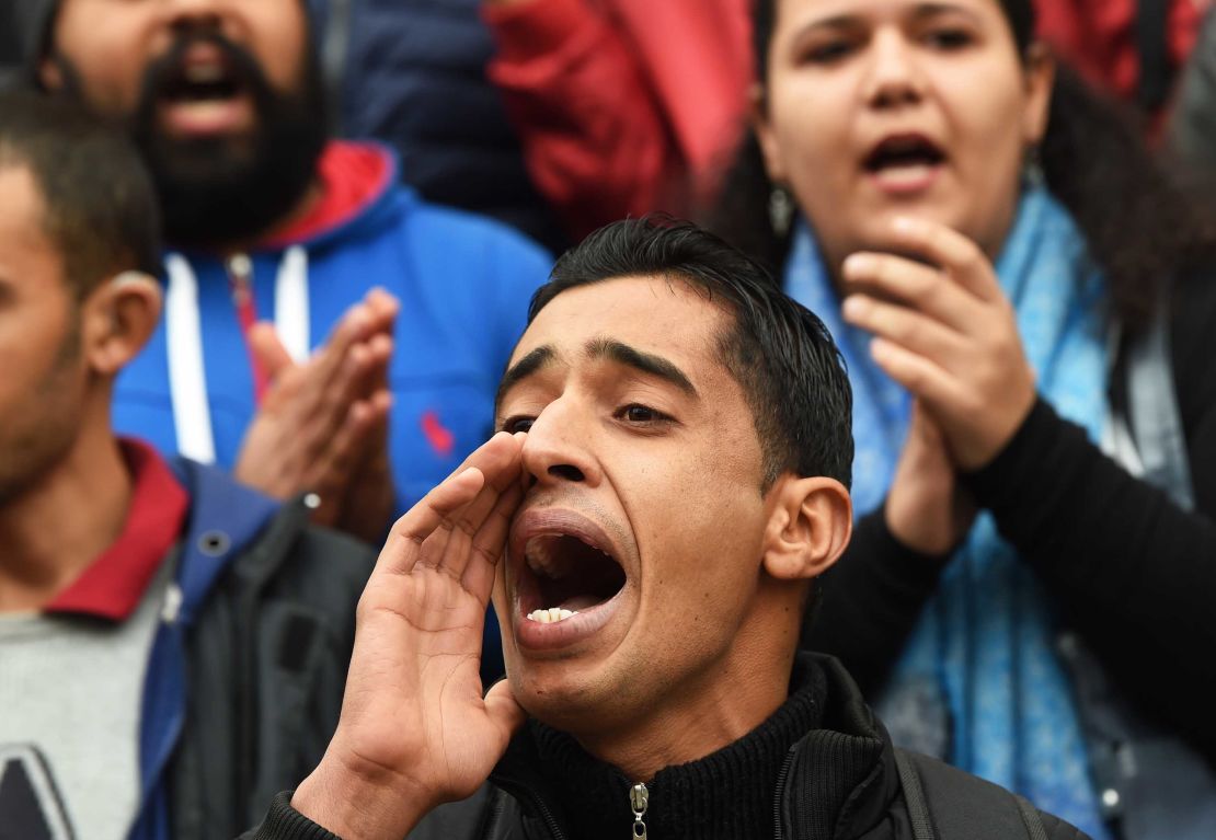 Tunisians shout slogans during a demonstration against the government and price hikes on January 9 in Tunis.